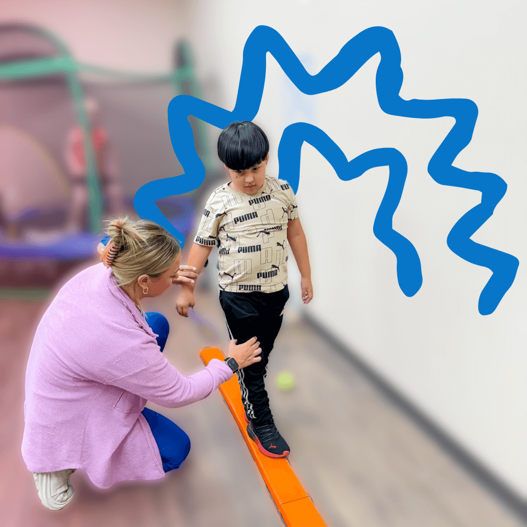 Child on balance beam in physical therapy