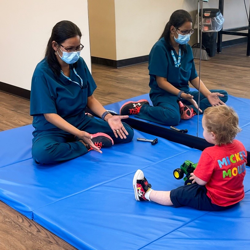 Child with toy in occupational therapy